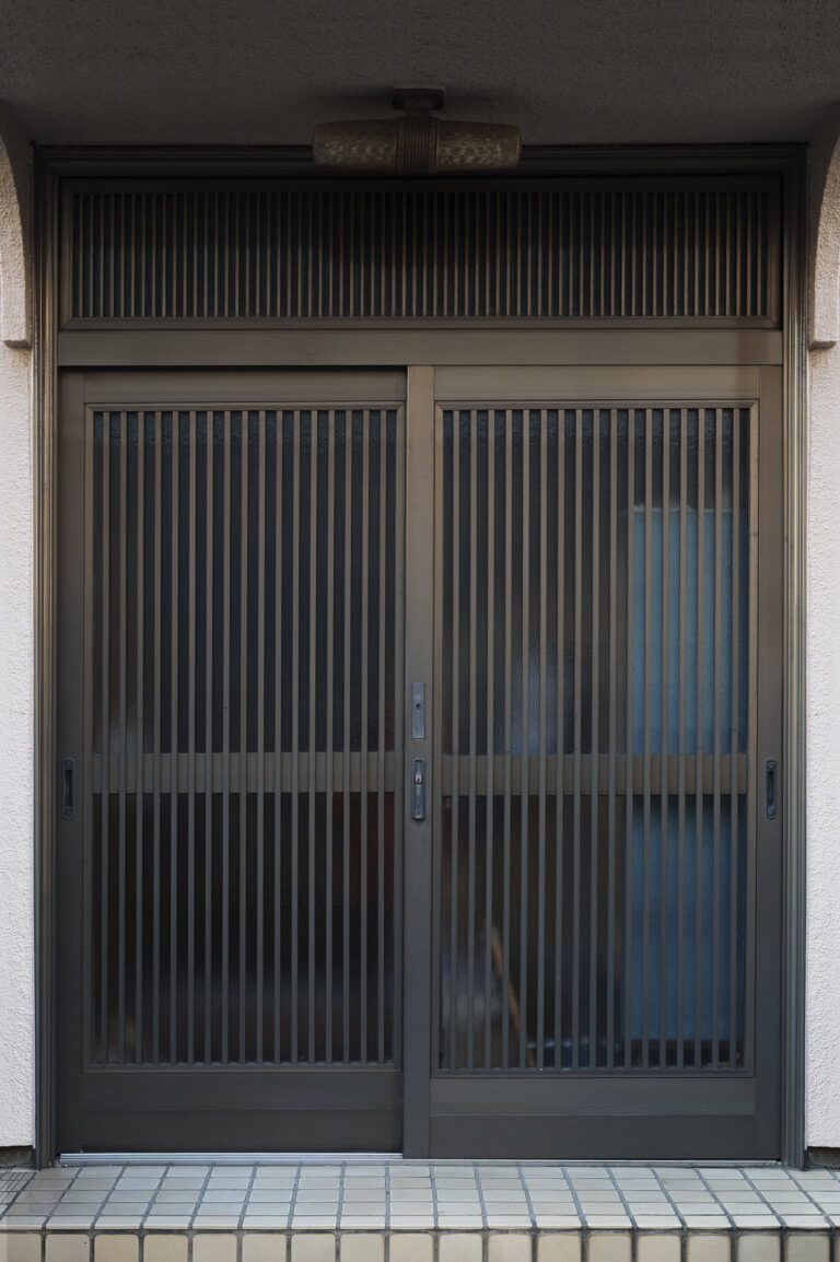Charcoal grey and warm white main gate for a clean, modern look